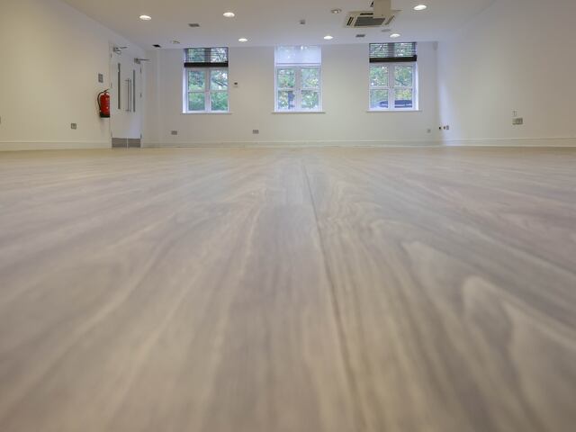 Office space transformed with pre-insulated walnut finish flooring