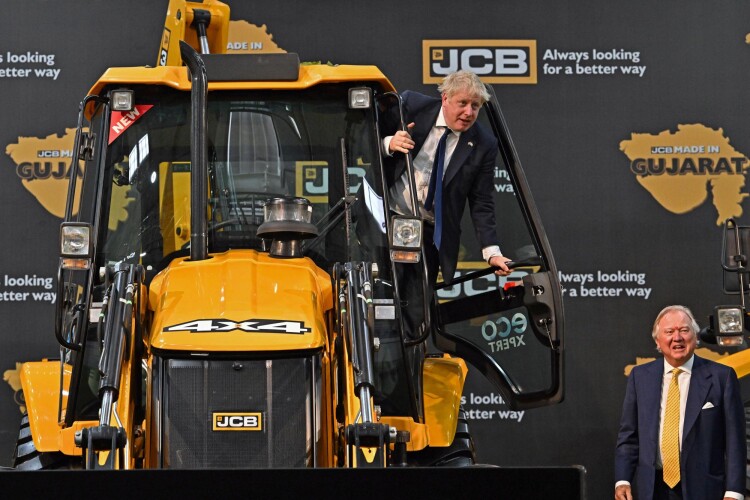 Boris Johnson pictured with JCB chairman Lord Bamford at JCB India&rsquo;s new &pound;100m factory in Gujurat
