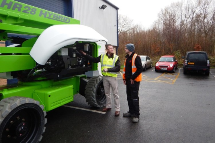 Niftylift UK sales manager Tim Ward (left) hands over the HR28 Hybrid to APL foreman Adam Preston