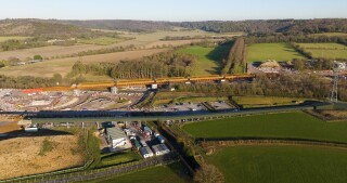 Aerial view of Small Dean viaduct deck in final position across road and railway line in Wendover