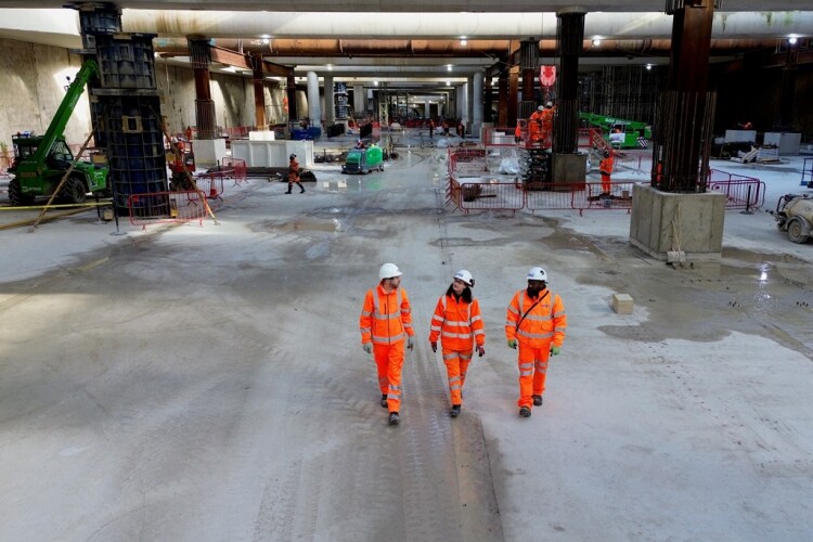 HS2 project manager Russell D'Urso, Kitty Bulmer from BBVS and Raj Alagenthirarajah from Expanded cross the competed base slab at Old Oak Common