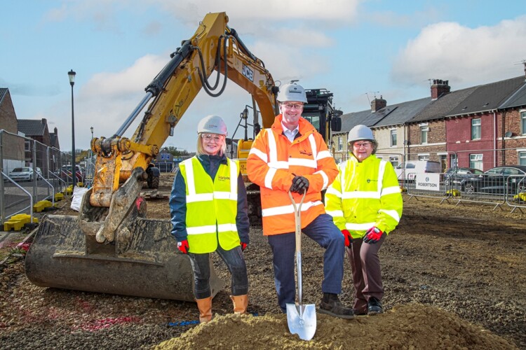 Robertson Construction North East managing director Neil Kennedy (centre) breaks ground with Karbon Homes assistant director Zoey Hawthorne (left) and South Tyneside councillor Ruth Berkley (right)