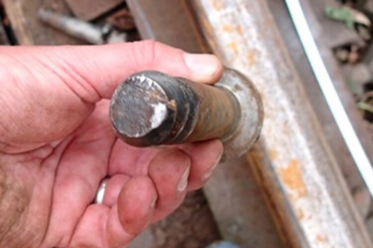 One of the recovered top portions of a screw with signs of historical fracture and subsequent failure by overload