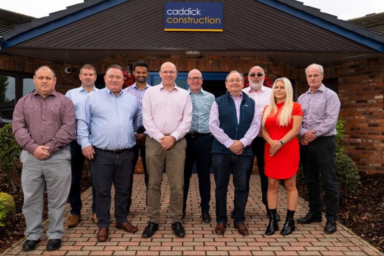 Members of the Caddick team with MD Paul Dodsworth (third from left) welcome their new colleagues