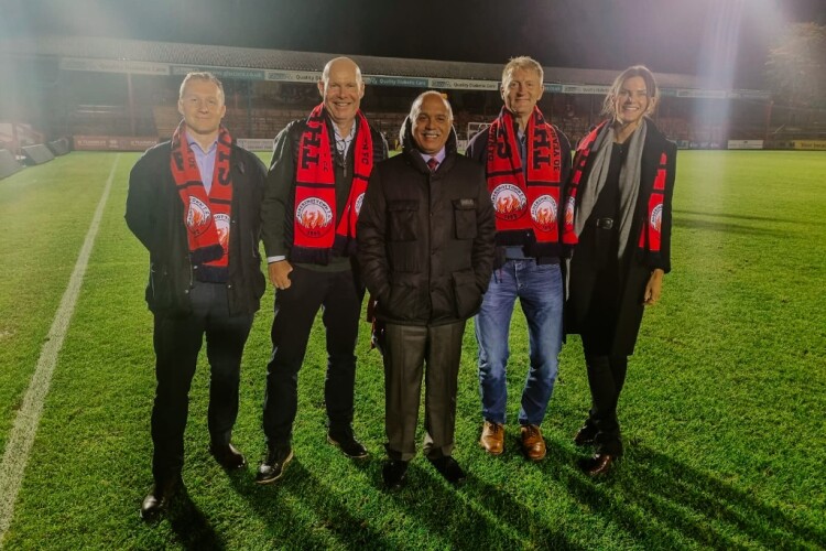 Aldershot Town chair Shahid Azeem (centre) flanked by the Wates team of (left to right) management trainee Will Cross, MD David Brocklebank, commercial director Adam Randall and land manager Camilla Budd 