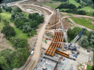 The beams being lifted into place