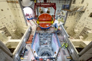 The reactor pressure vessel about to be lowered into the reactor pit