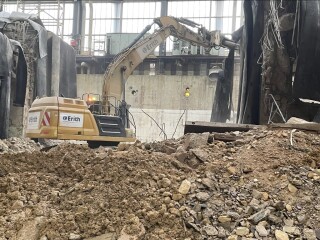 - Excavator removing rubble from Turbine plinth following weakening by using explosives 