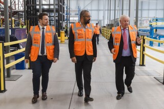 Shaun Weston (left) and Bob Weston (right) show local MP James Cleverly around the factory 
