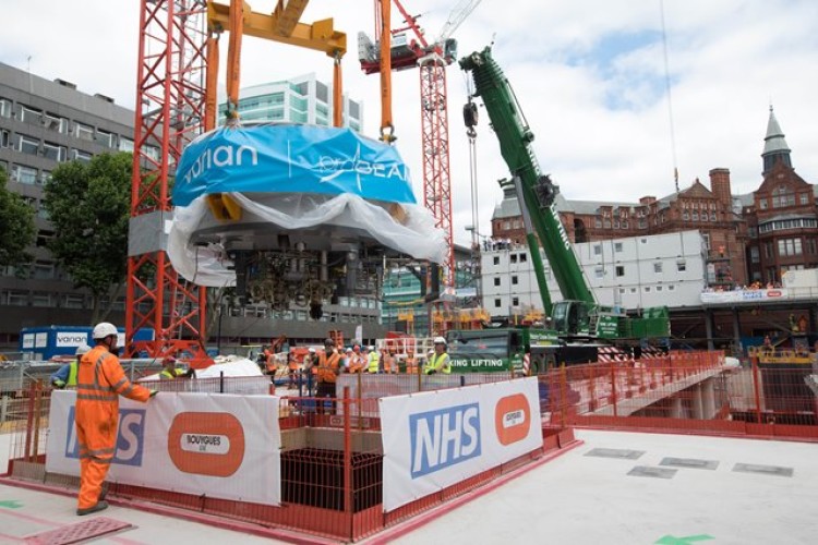 The cyclotron is carefully lowered into the bowels of the new hospital