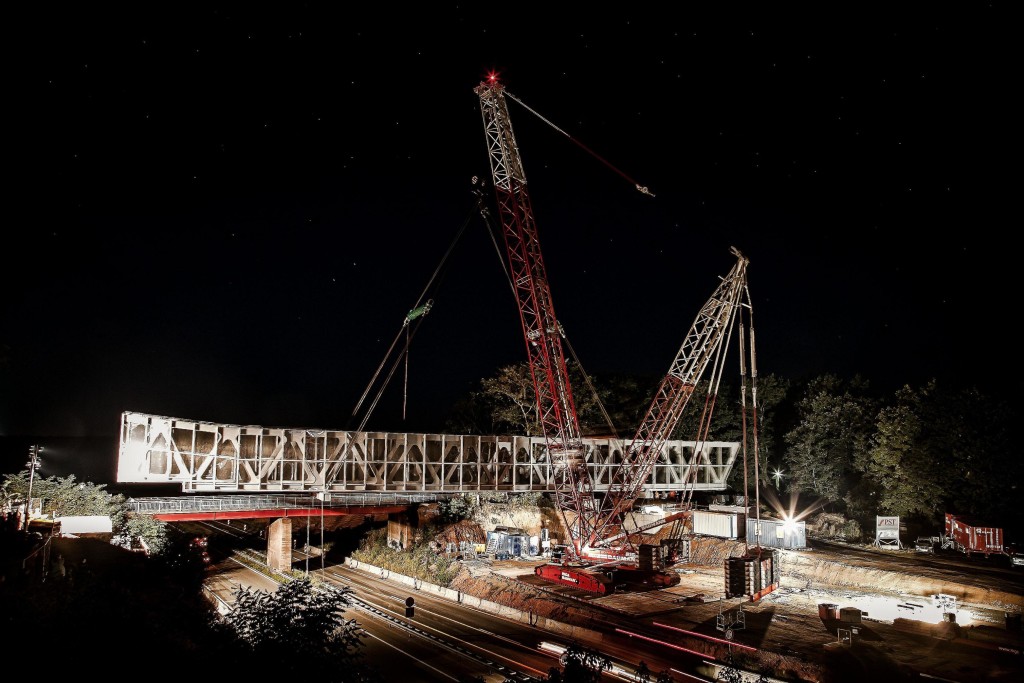 Terex CC 2500-1 crawler crane lifts steel bridge over the A6 freeway ...