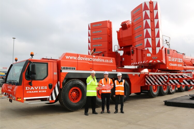 Neil Davies of Davies Crane Hire (centre) with Liebherr GB&rsquo;s Richard Everist (left) and Steve Elliot (right)