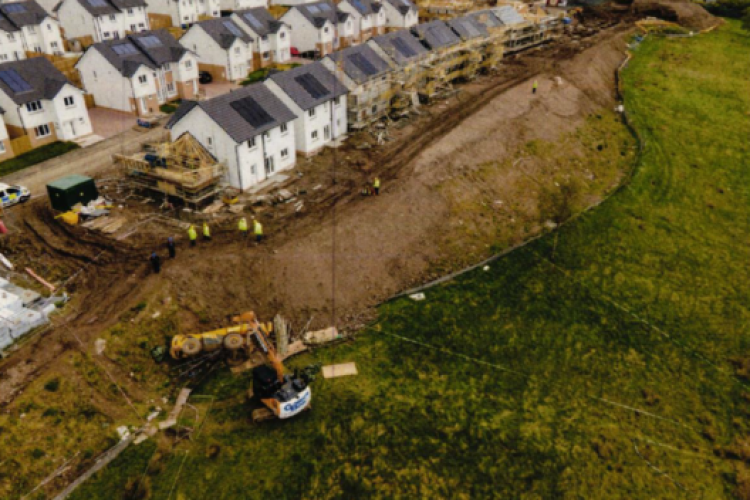 The telehandler tipped over down a bank while reversing