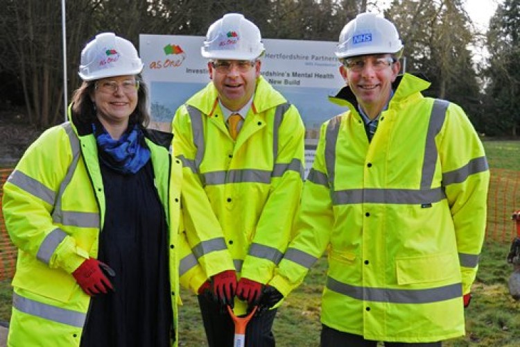 Hertfordshire Partnership NHS Foundation Trust chief executive Tom Cahill turned the first turf at Kingsley Green, helped by HPFT chair Hattie Llewellyn-Davies and Andrew Osborne (right)