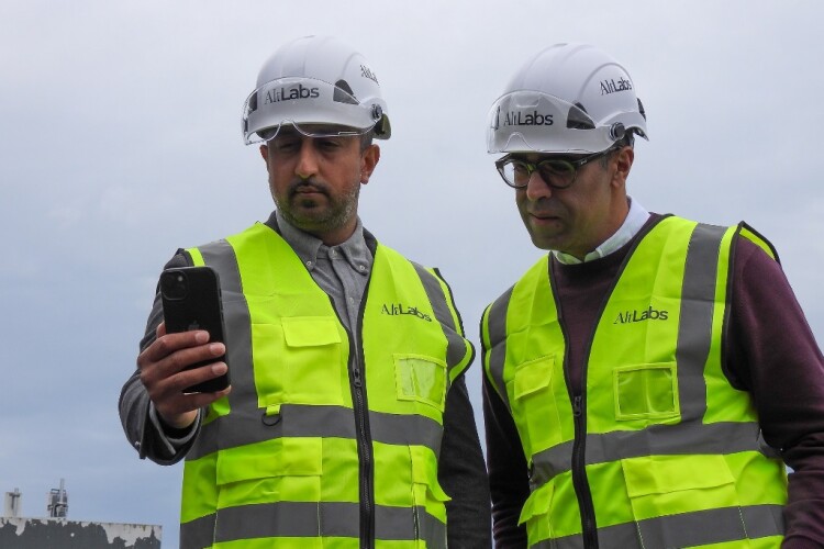 Aman Chahal of TaperedPlus (left) and Imran Anwar of Alt Labs test their technology that allows smartphones and tablets to be used to scan roof dimensions