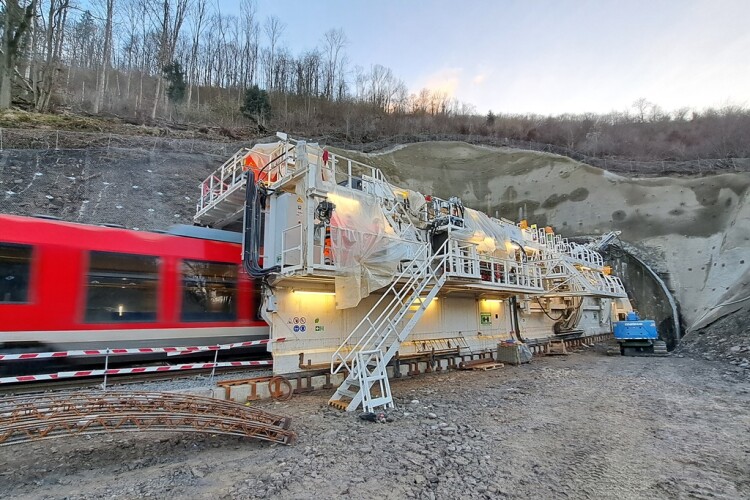 The train speeds right through the tunnel widening machine