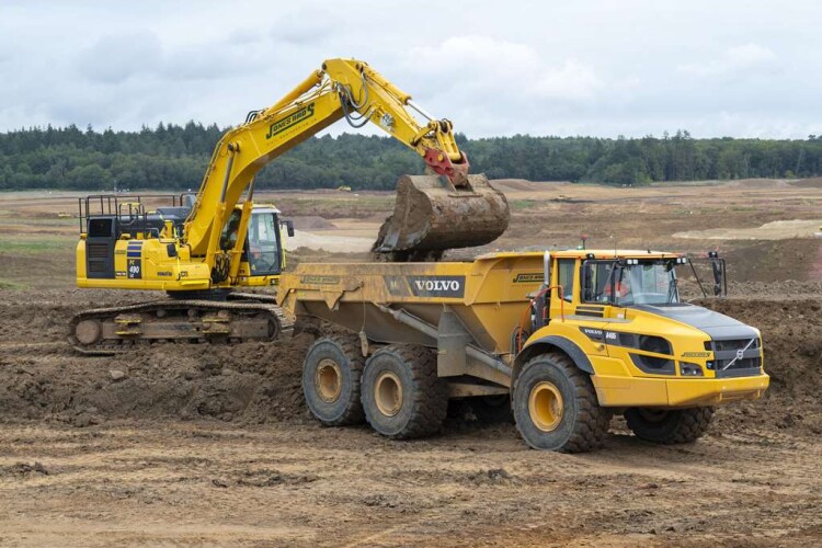 One of Jones Bros’ new PC490LCi excavators and Volvo A40G articulated dump trucks  working together on Havant Thicket reservoir