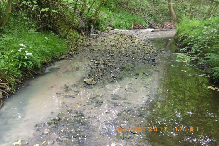 The impact is visible in the watercourse