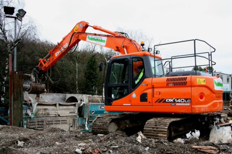 One of the new Doosan DX140LC units working in Shorts&rsquo; waste transfer station in Ascot