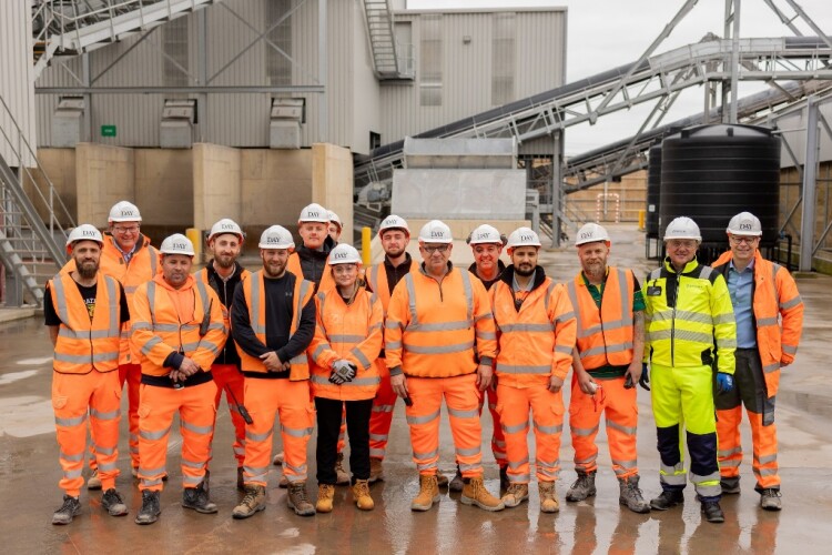 Wellingborough MP Gen Kitchen (front row, fourth from left) at the opening of the plant with the production team