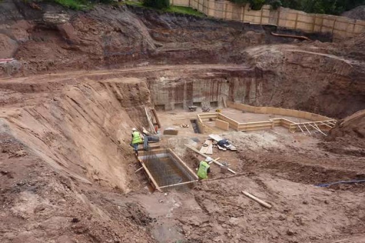 The pit excavated for foundations