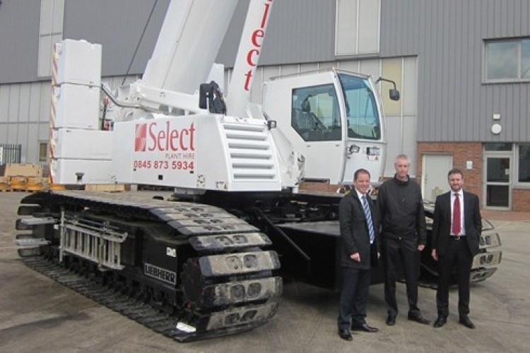 Liebherr sales manager Mark West, left, with Select&rsquo;s Nick Hooper and Jason Curtis
